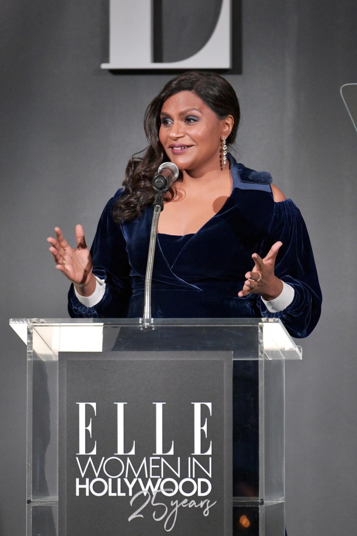Mindy Kaling speaks during Elle's 25th annual Women in Hollywood event.