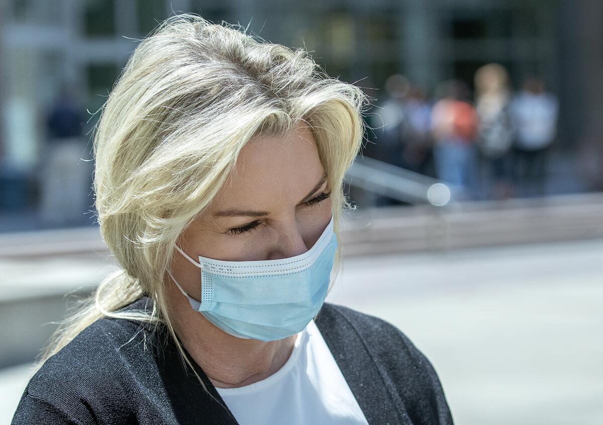 Rebecca Grossman wears a mask while leaving a Van Nuys courthouse in 2022.