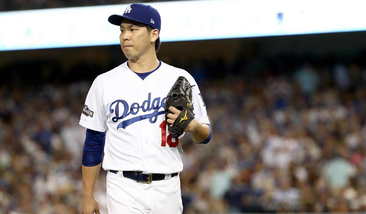 Dodgers pitcher Kenta Maeda is taken out of the game in the fourth inning against the Chicago Cubs in Game 5 of the NLCS Thursday.