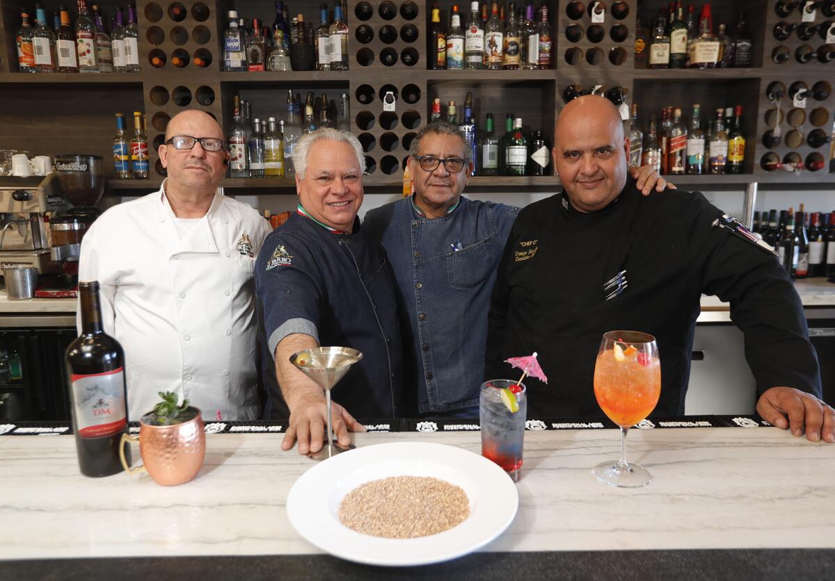 Domenico Maurici, with staff members Gerardo Lemus, Victor Morales and "Chef O" Oronzo Rosato.