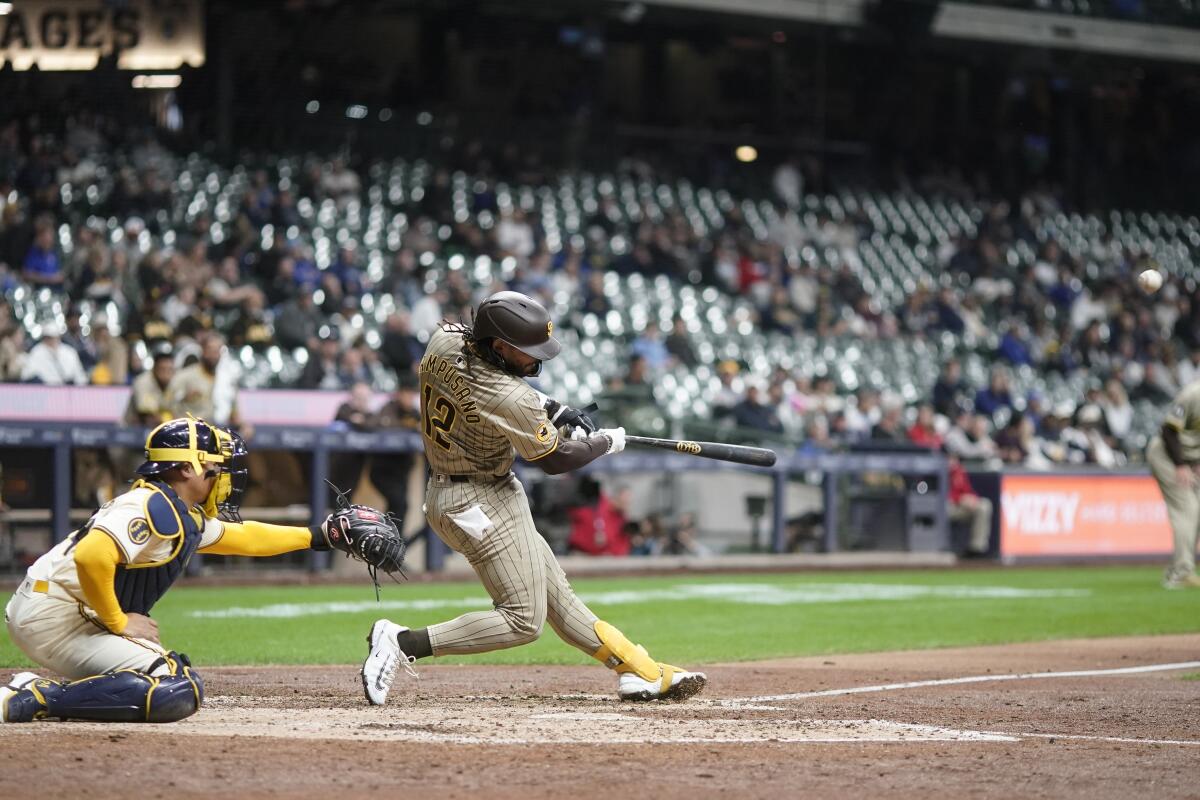 The Padres' Luis Campusano hits an RBI single against the Brewers 