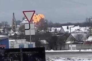 In this handout photo taken from validated UGC video show flames rising from the scene of a warplane crashed at a residential area near Yablonovo, Belgorod region, Wednesday, Jan. 24, 2024. Ukraine claimed Thursday, Feb. 1, 2024 it used sea drones to sink a Russian corvette in the Black Sea, while Russian investigators alleged that two Patriot missiles fired by Kyiv’s forces brought down a Russian military transport plane last month. (Validated UGC video via AP)