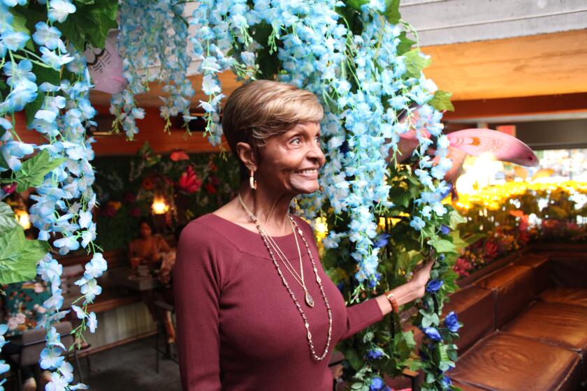 Local transgender activist Tracie Jada O'Brien poses for a portrait in InsideOut, a restaurant in Hillcrest, San Diego.