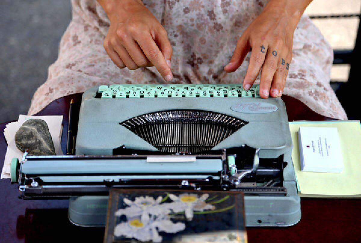 Jacqueline Suskin writes a poem for a customer at her Poem Store at the Hollywood Farmers Market. "Part of the exercise is to get down immediately whatever comes to me," she says. "They are like little mantras, little prayers that get handed out."