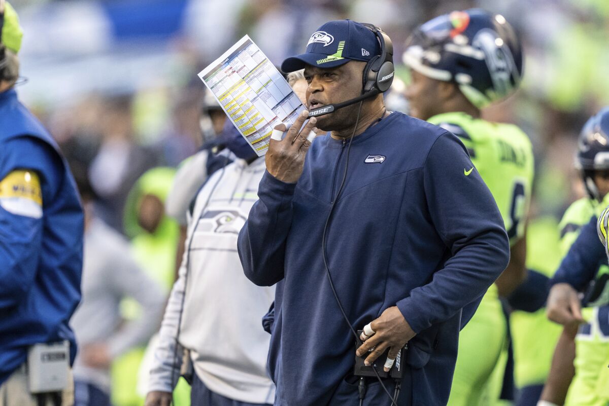 FILE - Seattle Seahawks defensive coordinator Ken Norton Jr. watches from the sideline during the first half of an NFL football game against the Los Angeles Rams, Thursday, Oct. 7, 2021, in Seattle. The Seattle Seahawks have fired defensive coordinator Ken Norton Jr. and passing game coordinator Andre Curtis, the team said Tuesday., Jan. 18, 2022 (AP Photo/Stephen Brashear, File)
