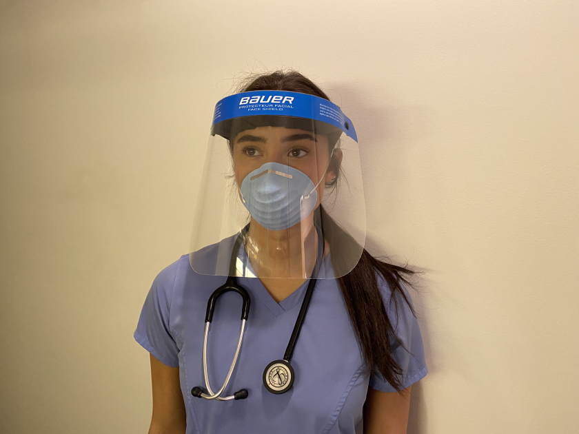 Brooke Macri, a nurse at the Elliot Hospital in Manchester, N.H., wears a Bauer face shield.
