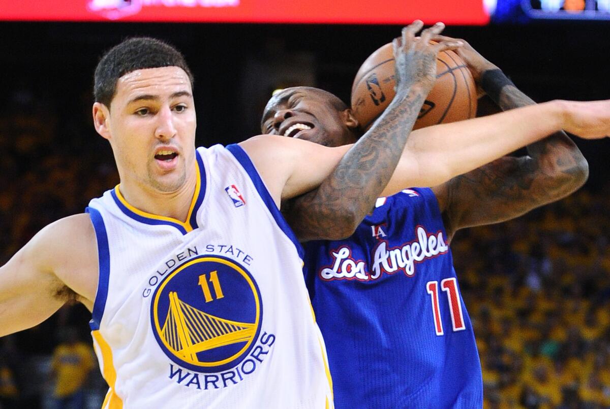 Clippers Jamal Crawford is fouled by Warriors forward Klay Thompson during a 2014 NBA playoff game.