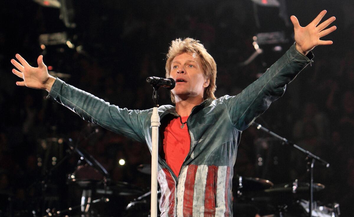 In this Nov. 5, 2013, file photo, Jon Bon Jovi performs in concert with his band on their Because We Can Tour 2013, in Philadelphia.