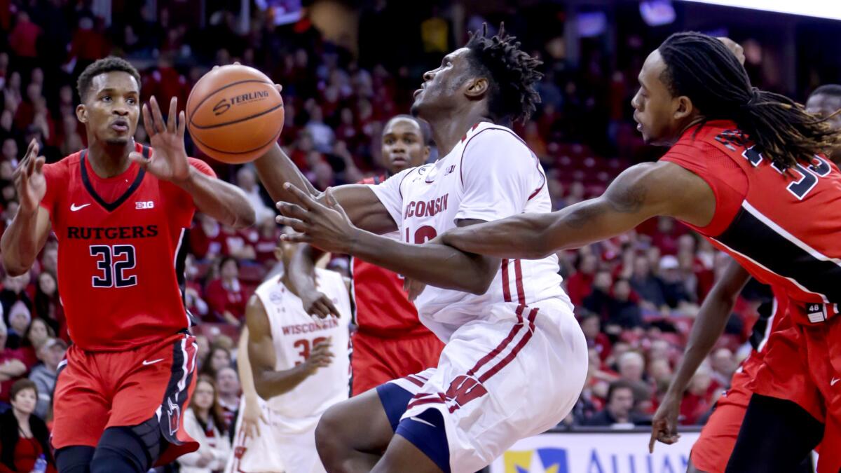 Rutgers' Deshawn Freeman, right, fouls Wisconsin's Nigel Hayes during the second half Tuesday.