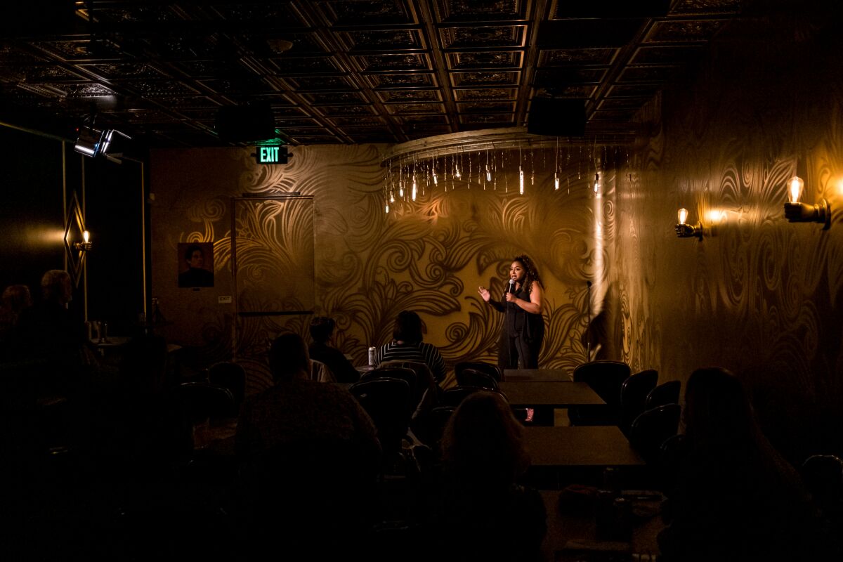 Comedian Jasmine Ellis performs in the Gold Room at Mic Drop Comedy during the comedy club's opening weekend.