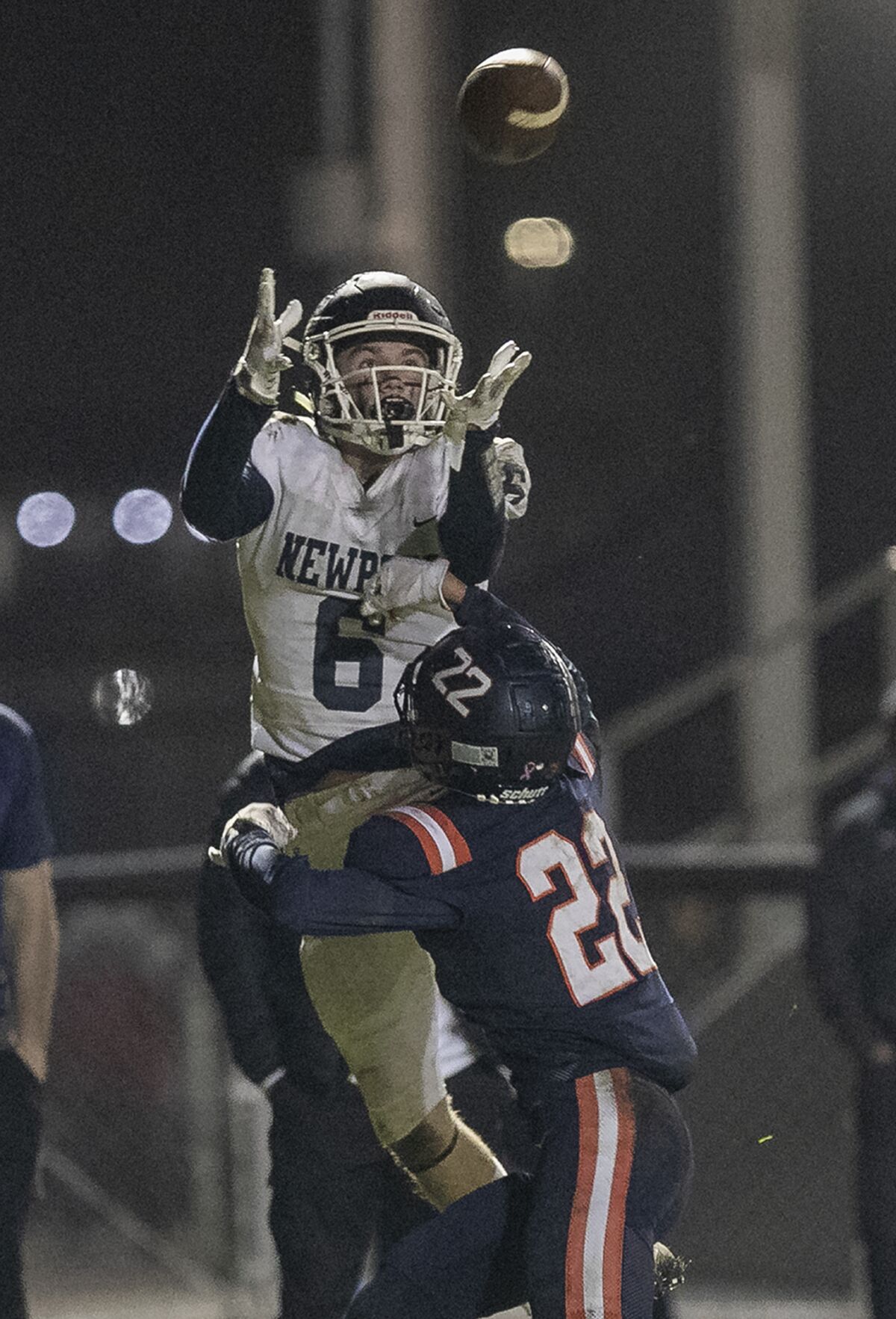 Newport Harbor's Kashton Henjum makes a catch over Cypress' Jesse Mauldin for a two-point conversion on Friday.