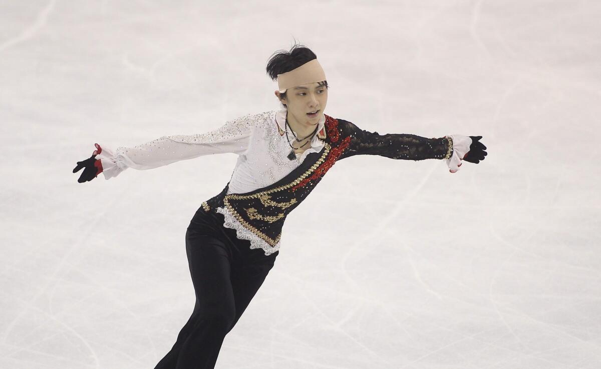 Japanese skater Yuzuru Hanyu competed with his head wrapped in a bandage and appeared shaky on the way to a second-place finish during the men's free skate event Saturday at the Cup of China.