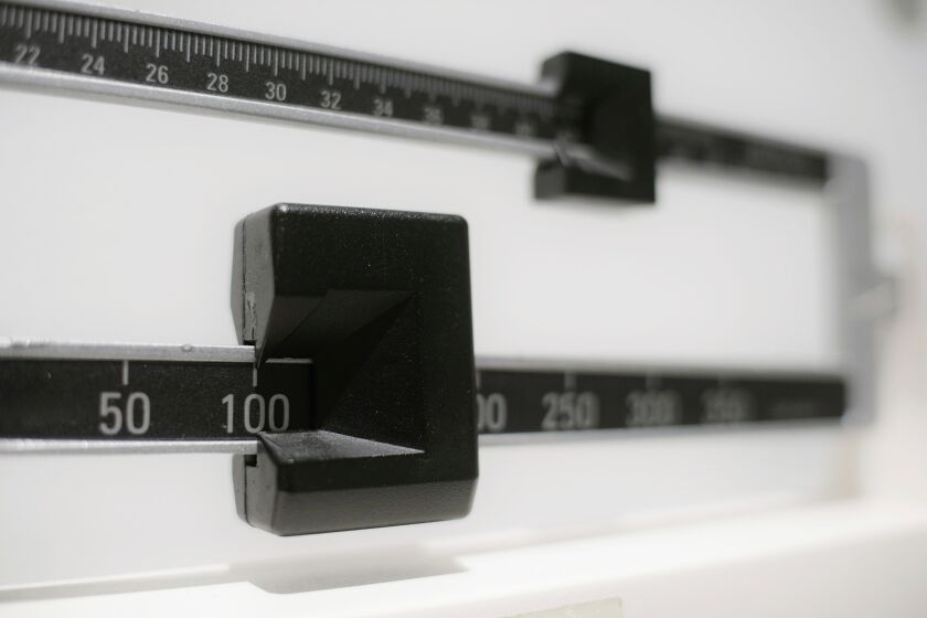 FILE - This Tuesday, April 3, 2018 file photo shows a closeup of a beam scale in New York. The Food and Drug Administration is warning consumers, Thursday, June 1, 2023, not to use off-brand versions of the popular weight-loss drugs Ozempic and Wegovy sold online because they might not contain the same ingredients as the prescription products and may not be safe or effective. (AP Photo/Patrick Sison, File)