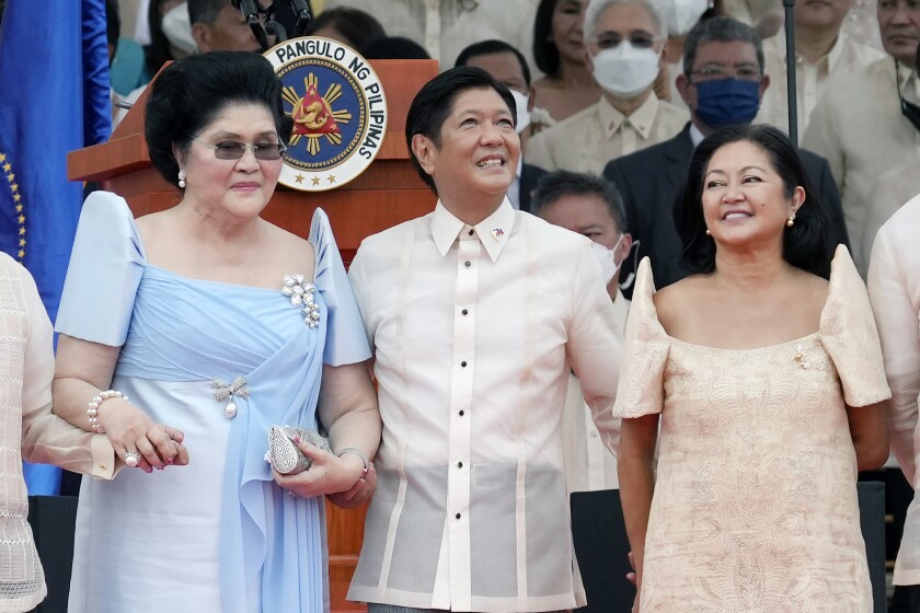 President Ferdinand Marcos Jr. stands with his mother Imelda Marcos, left, and his wife Maria Louise Marcos, right, during the inauguration ceremony at National Museum on Thursday, June 30, 2022 in Manila, Philippines. Marcos was sworn in as the country's 17th president. (AP Photo/Aaron Favila)