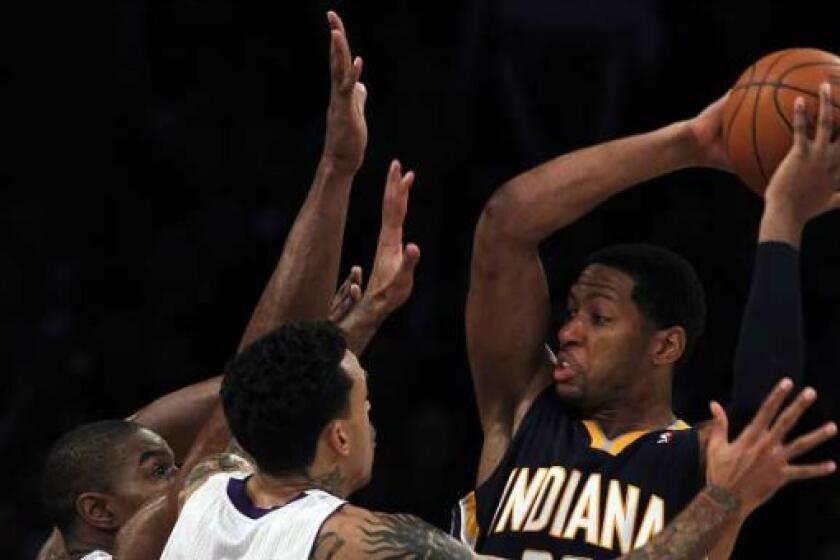 The Lakers' Andrew Bynum and Matt Barnes team up against the Pacers' Danny Granger during a game at the Staples Center earlier this year.