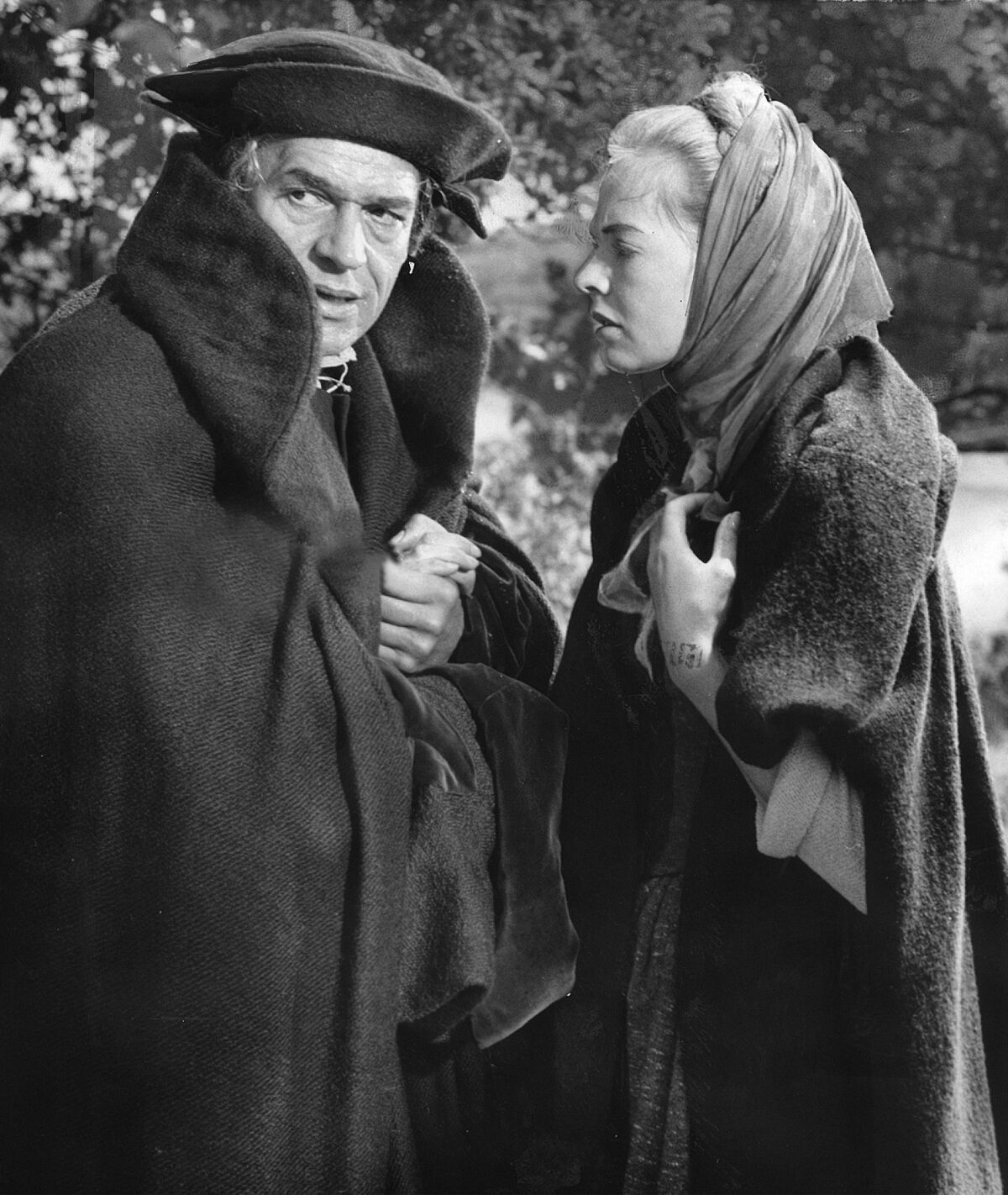 black and white photo of a man and a woman bundled up in coats