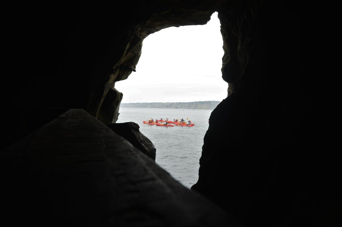 Sunny Jim Sea Cave, with kayakers beyond, in La Jolla.