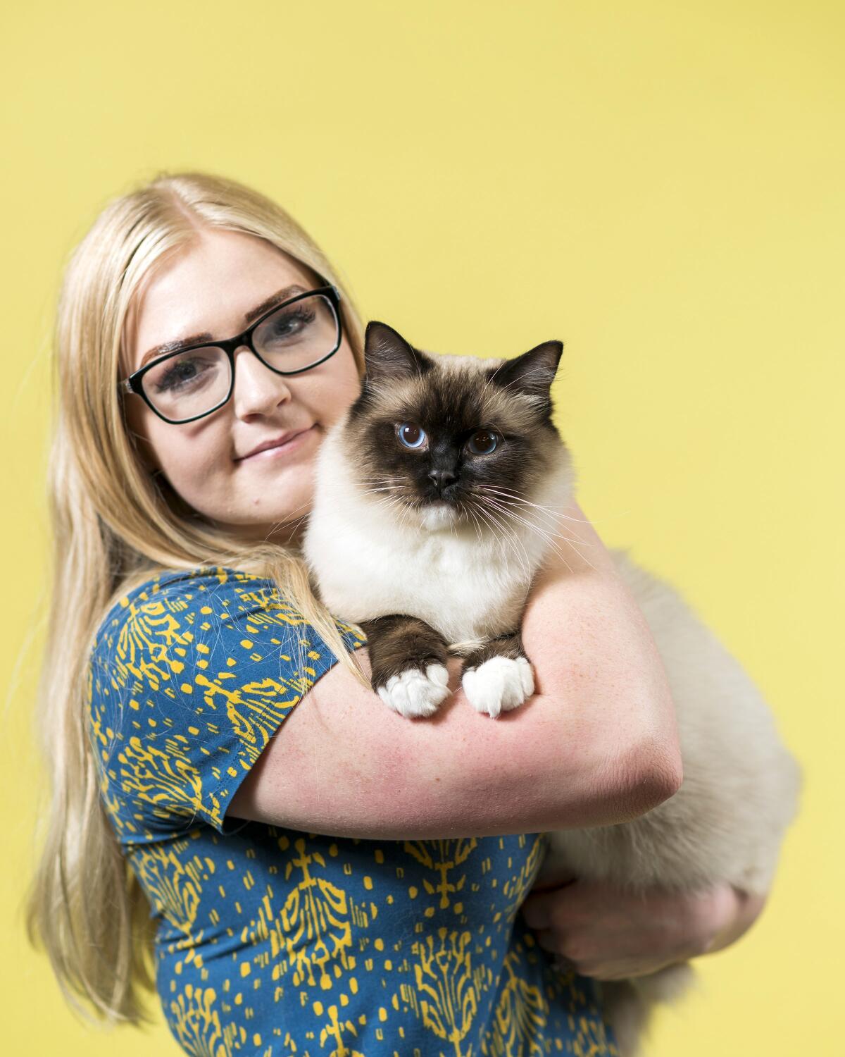 Jentry Hendricks holds her Ragdoll cat named Cosmo.