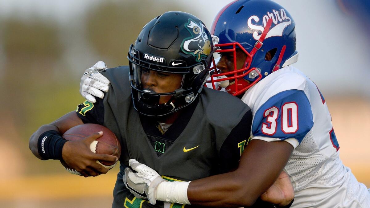 A week after handing Justin Patterson (30) and Gardena Serra its first of two losses this season, quarterback Jalen Chatman and Narbonne fell to Long Beach Poly.