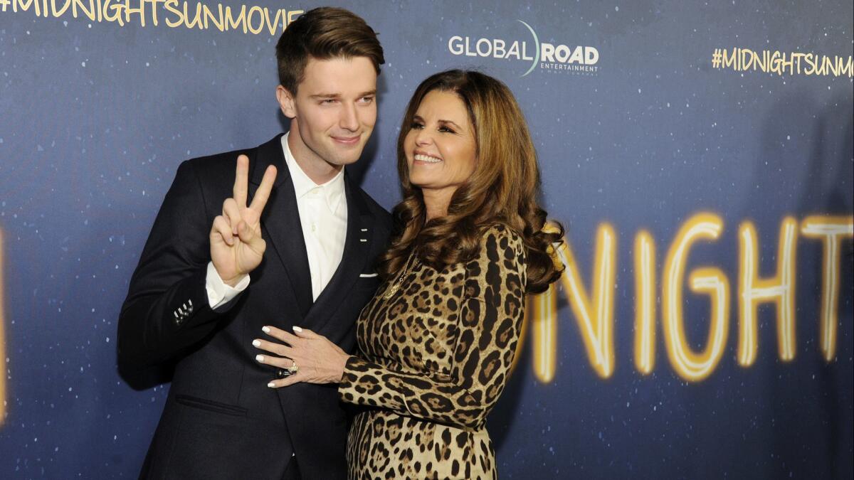 Patrick Schwarzenegger, poses with his mother, Maria Shriver, at the Hollywood premiere of "Midnight Sun."
