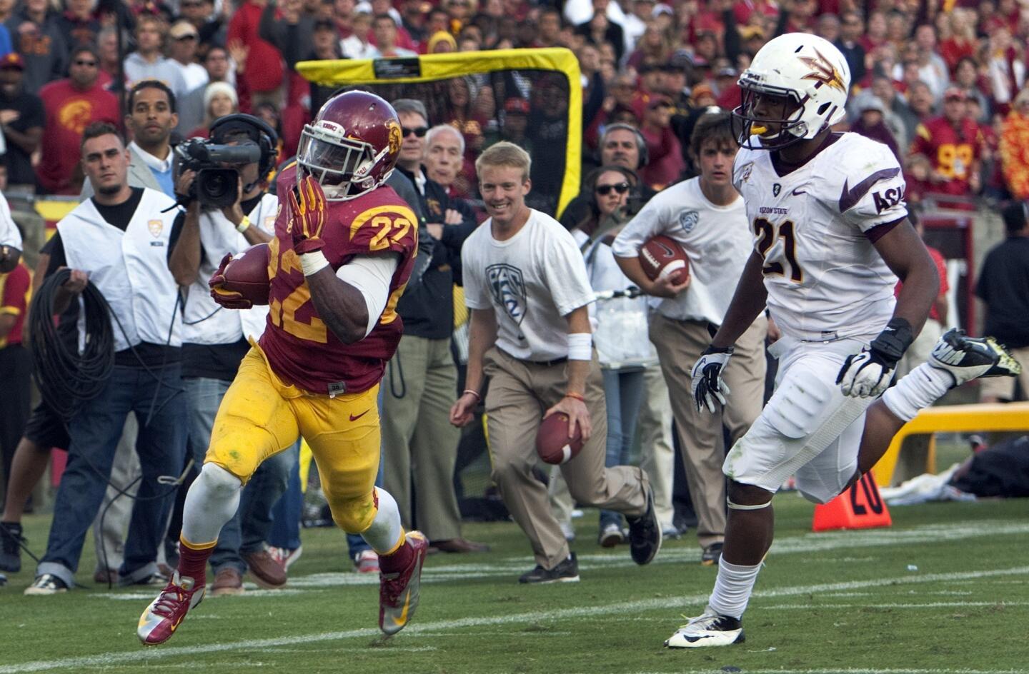 USC running back Curtis McNeal gets past Arizona State safety Chris Young to score the final touchdown of the game on Saturday.