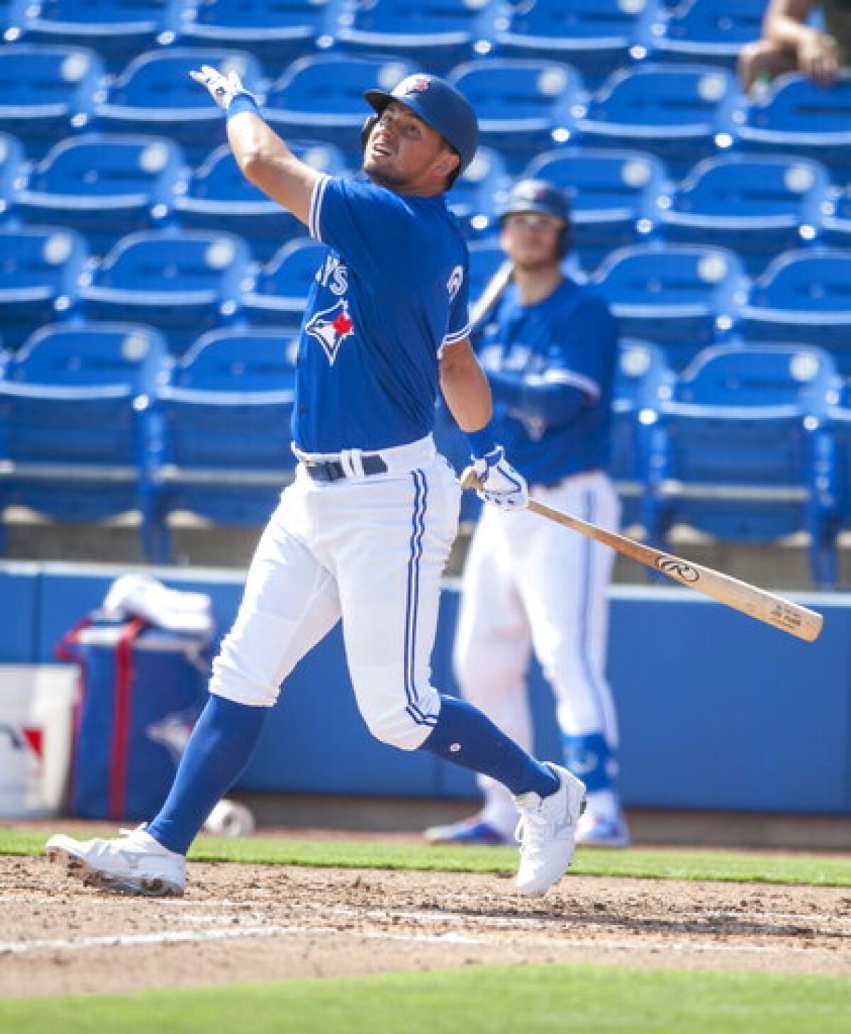 Toronto Blue Jays' Joie Panik hits an RBI-single during the third inning of a spring training baseball game against the Baltimore Orioles, Friday, March 5, 2021, at TD Ballpark in Dunedin, Fla. (Steve Nesius/The Canadian Press via AP)