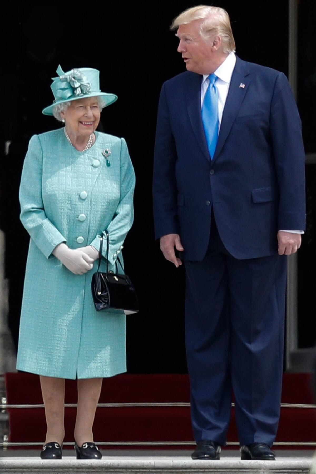 Queen Elizabeth II smiles as she speaks with President Trump during a welcome ceremony at Buckingham Palace on June 3, 2019.