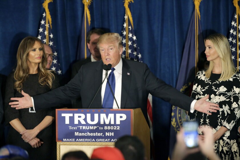 Republican presidential candidate Donald Trump speaks to supporters during a primary night rally on Feb. 9 in Manchester, N.H. At his side are his wife Melania Trump, left, and daughter Ivanka Trump, right.