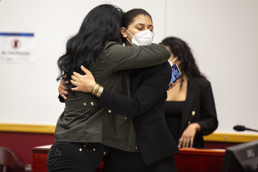 Des Moines Register reporter Andrea Sahouri hugs her mother Muna Tareh-Sahouri after being found not guilty at the conclusion of her trial at the Drake University Legal Clinic, Wednesday, March 10, 2021, in Des Moines, Iowa. An Iowa jury on Wednesday acquitted journalist Sahouri who was pepper-sprayed and arrested by police while covering a protest in a case that critics have derided as an attack on press freedom and an abuse of prosecutorial discretion. (Kelsey Kremer/The Des Moines Register via AP)