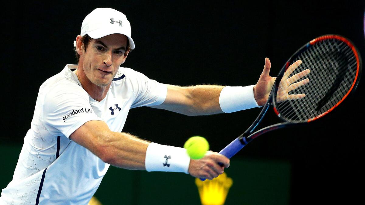 Andy Murray attempts a volley against Grigor Dimitrov during the championship match of the China Open on Sunday.