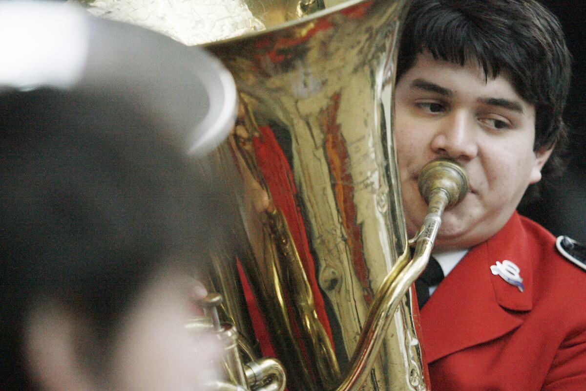 Israel Doria plays his instrument during a Christmas distribution, which took place at the Salvation Army in Burbank on Thursday, December 15, 2011. The Salvation Army is expecting over 1200 people during the distribution.