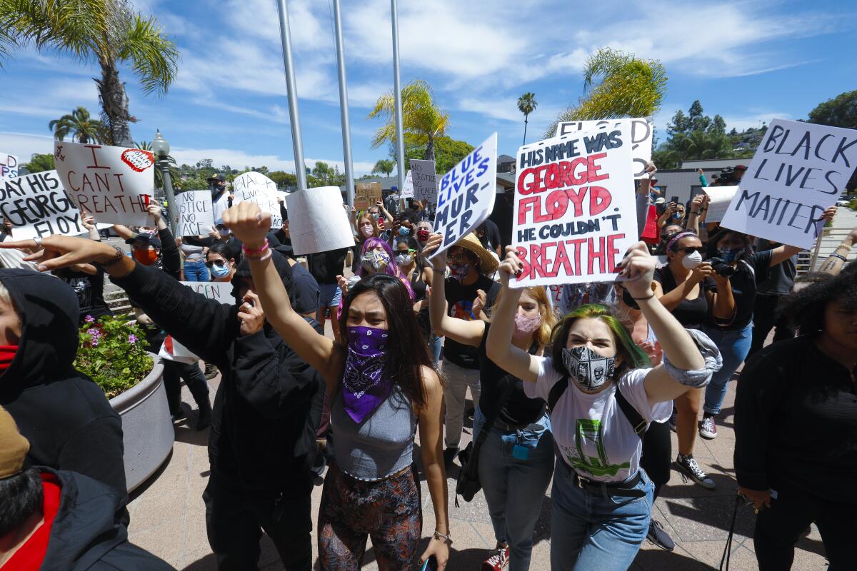 Protesters on Saturday began their demonstration in front of the La Mesa Police Department.