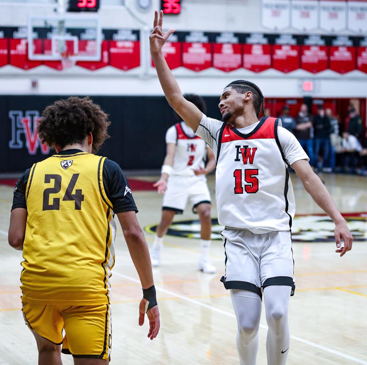 Harvard-Westlake's Christian Horry celebrates by raising three fingers on his right hand in the air during a win over Crespi.