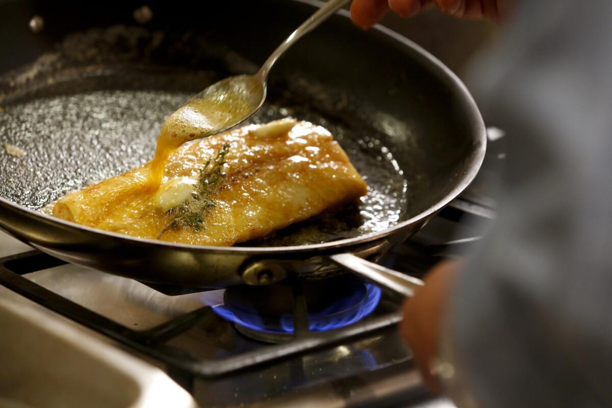 While sauteeing in the pan, the fish is basted with butter and its juices to keep it moist.