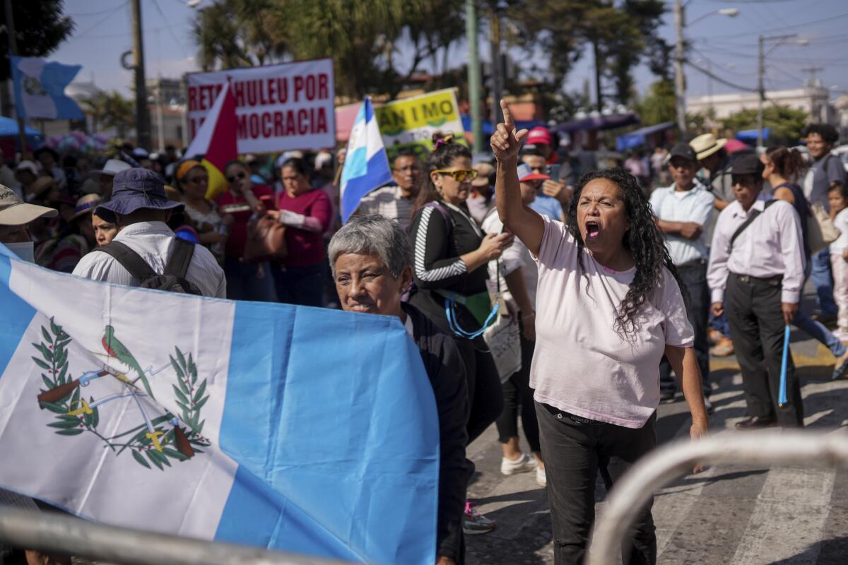 Supporters of Guatemalan President-elect Bernardo Arévalo protest a delay of his inauguration in Guatemala City.
