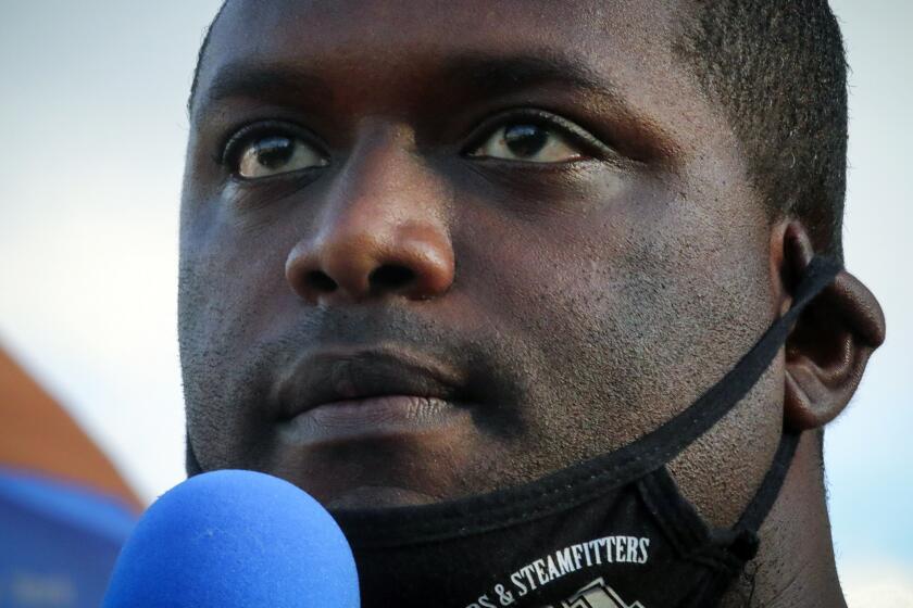 Mondaire Jones, winner of the Democratic primary for the 17th Congressional District, addresses a Black Lives Matter rally, Wednesday, July 15, 2020, outside the Westchester County courthouse in White Plains, N.Y. If he wins in November, Jones will join a record number of openly-LGBTQ elected officials in the United States. (AP Photo/Bebeto Matthews)