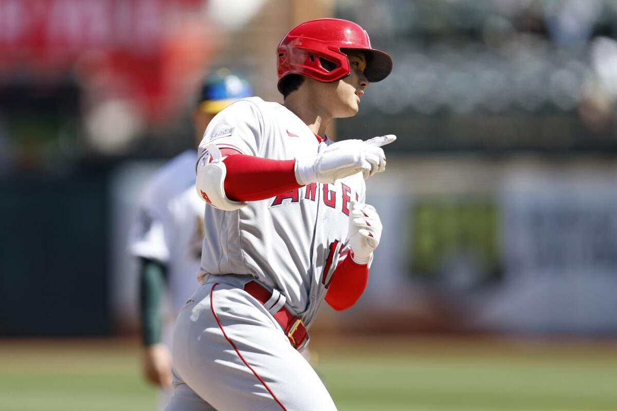 Angels star Shohei Ohtani rounds the bases after hitting a home run during the fifth inning.