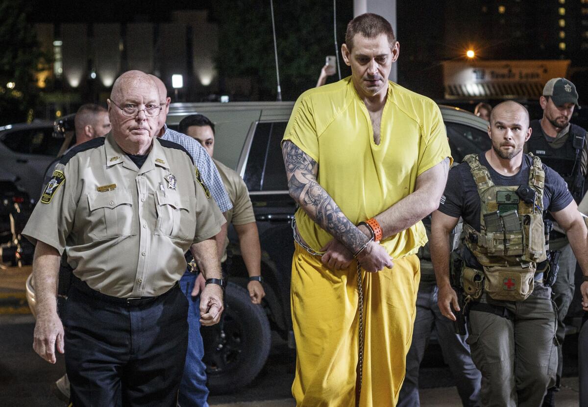 FILE - Escaped inmate Casey White arrives at the Lauderdale County Courthouse in Florence, Ala., after waiving extradition in Indiana, on May 10, 2022. White, 38, has been indicted on a murder charge for the shooting death of Vicky White, Lauderdale County District Attorney Chris Connolly announced Tuesday, July 12, 2022. The pair's disappearance from an Alabama jail in April sparked a national manhunt that came to a bloody end in Indiana where Casey White was captured and Vicky White died. (Dan Busey/The TimesDaily via AP, File)