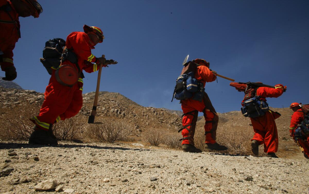 Inmate fire crews from Northern California prepare to battle the Silver fire in Riverside County in August 2013.