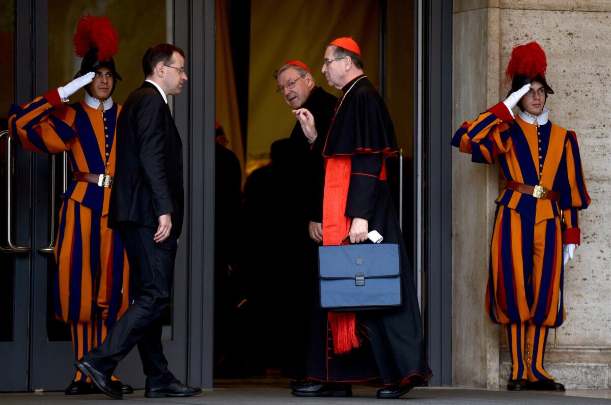 Cardinals Raymond Burke, center left, and Roger M. Mahony at the Vatican in March, during the selection process for a new pope.
