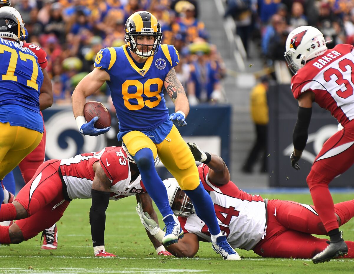 The Rams' Tyler Higbee finds some running room in the Cardinals' secondary after the tight end made a catch.