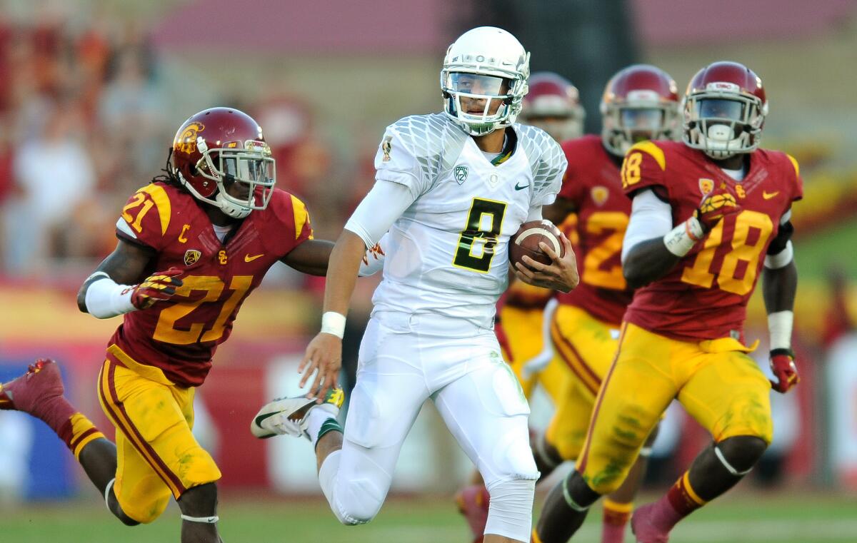 Oregon quarterback Marcus Mariota (8) passed for 304 yards and ran for 96 yards against USC last season.