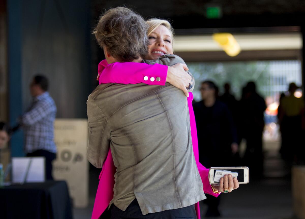 Actress Cate Blanchett greets artist Julian Rosefeldt at Hauser & Wirth gallery.