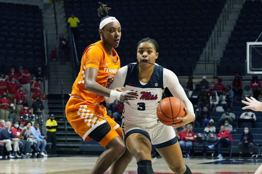 Mississippi guard Donnetta Johnson (3) dribbles around Tennessee guard Jordan Horston (25) during the second half of an NCAA college basketball game in Oxford, Miss., Sunday, Jan. 9, 2022. (AP Photo/Rogelio V. Solis)