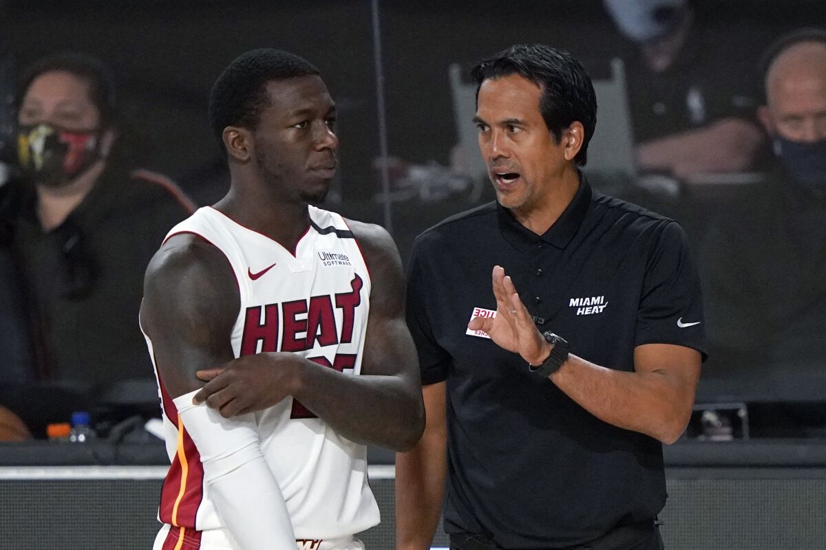 Heat guard Kendrick Nunn and coach Erik Spoelstra talk during a playoff game last month.