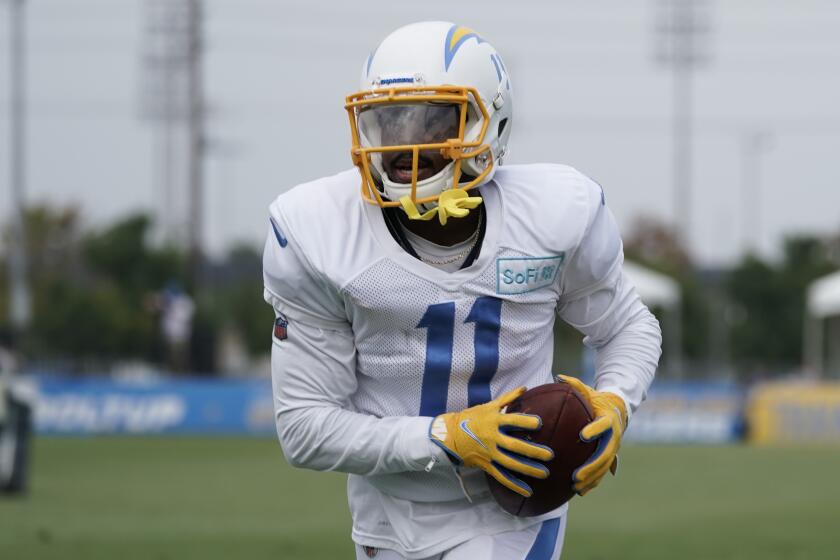 Los Angeles Chargers wide receiver Darius Jennings carries the ball during an NFL football camp practice.