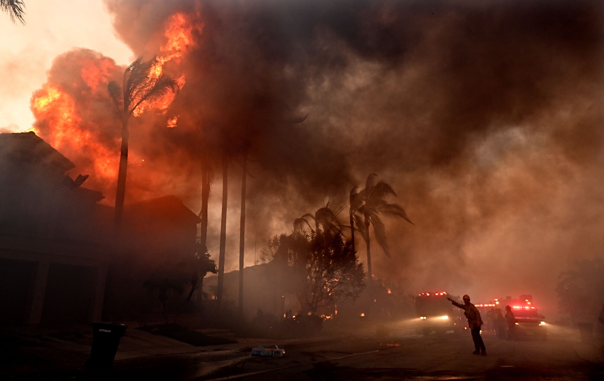Firefighters battle the Coastal fire in the Coronado Pointe community in Laguna Niguel.
