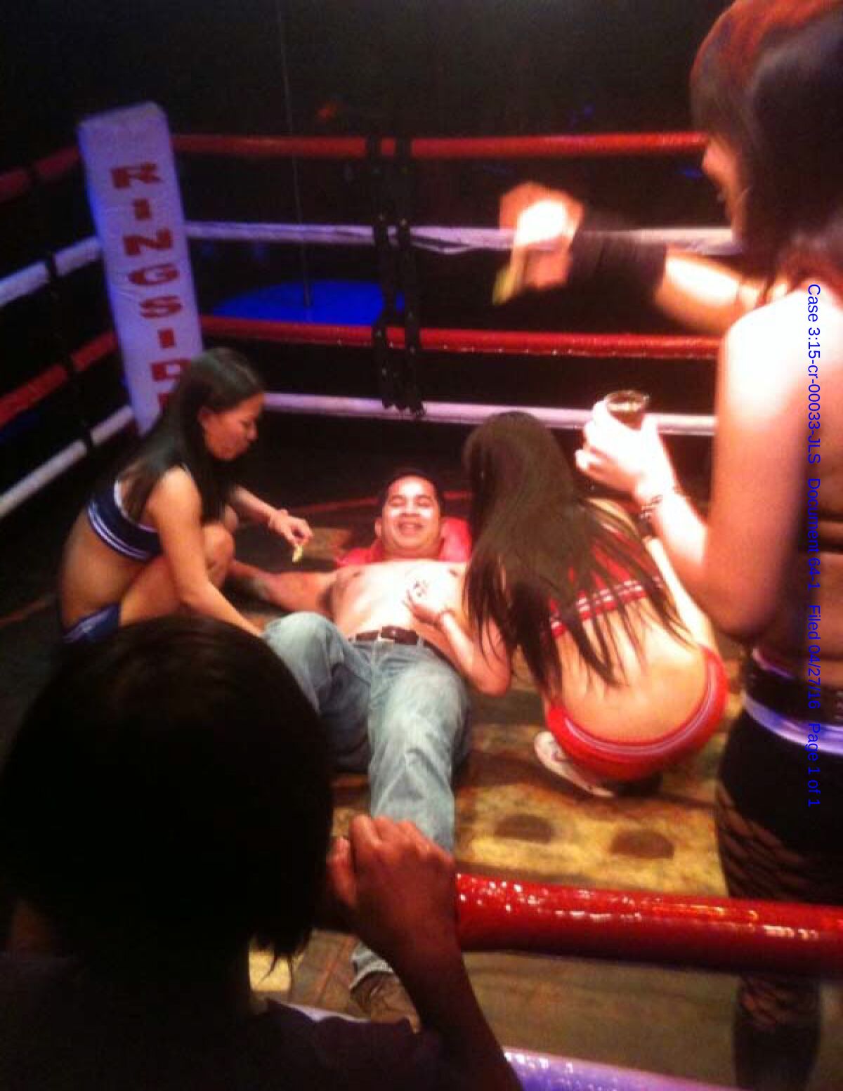 Former Navy Cmdr. Michael Misiewicz lies flat on his back in a boxing ring