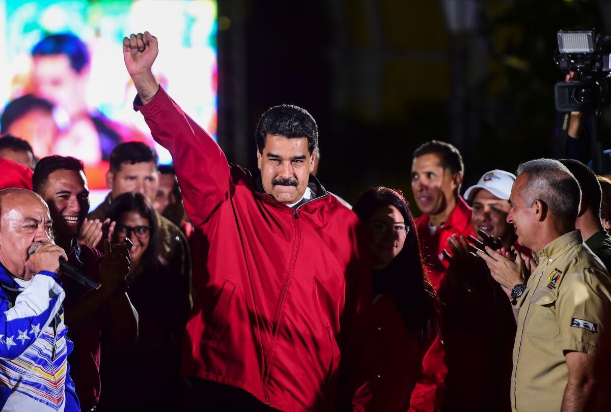 Venezuelan President Nicolas Maduro celebrates the results of Sunday's election in Caracas.