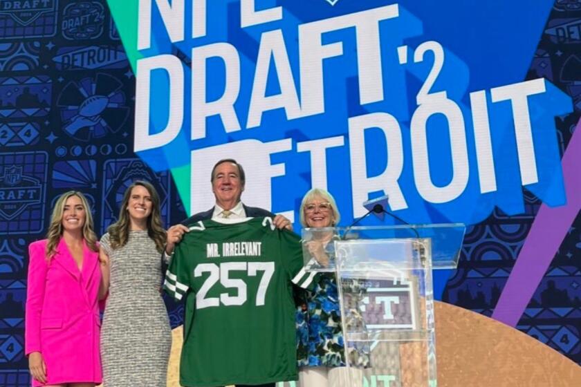 Melanie Salata Fitch, far right, stands with family to announce the Mr. Irrelevant pick at the 2024 NFL Draft.